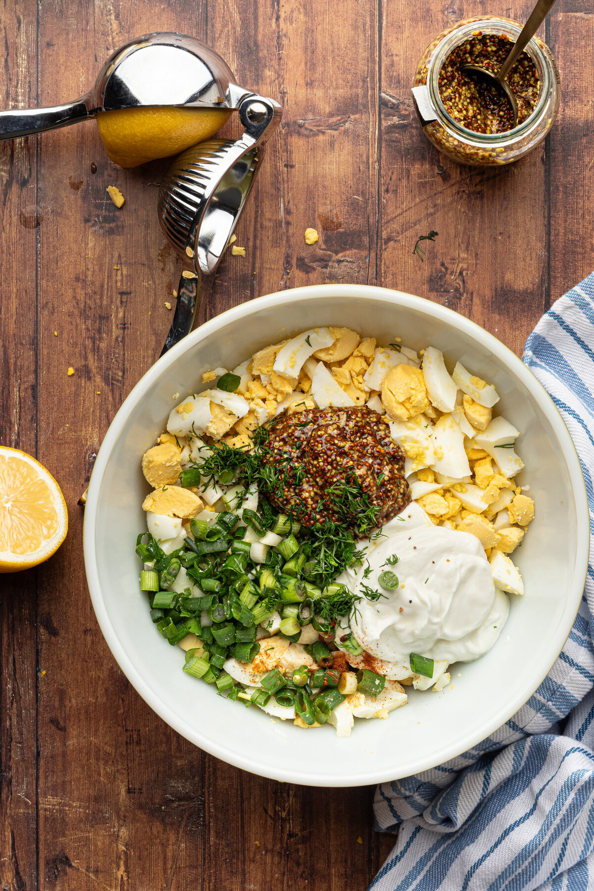 a bowl of egg salad ingredients before being mixed together