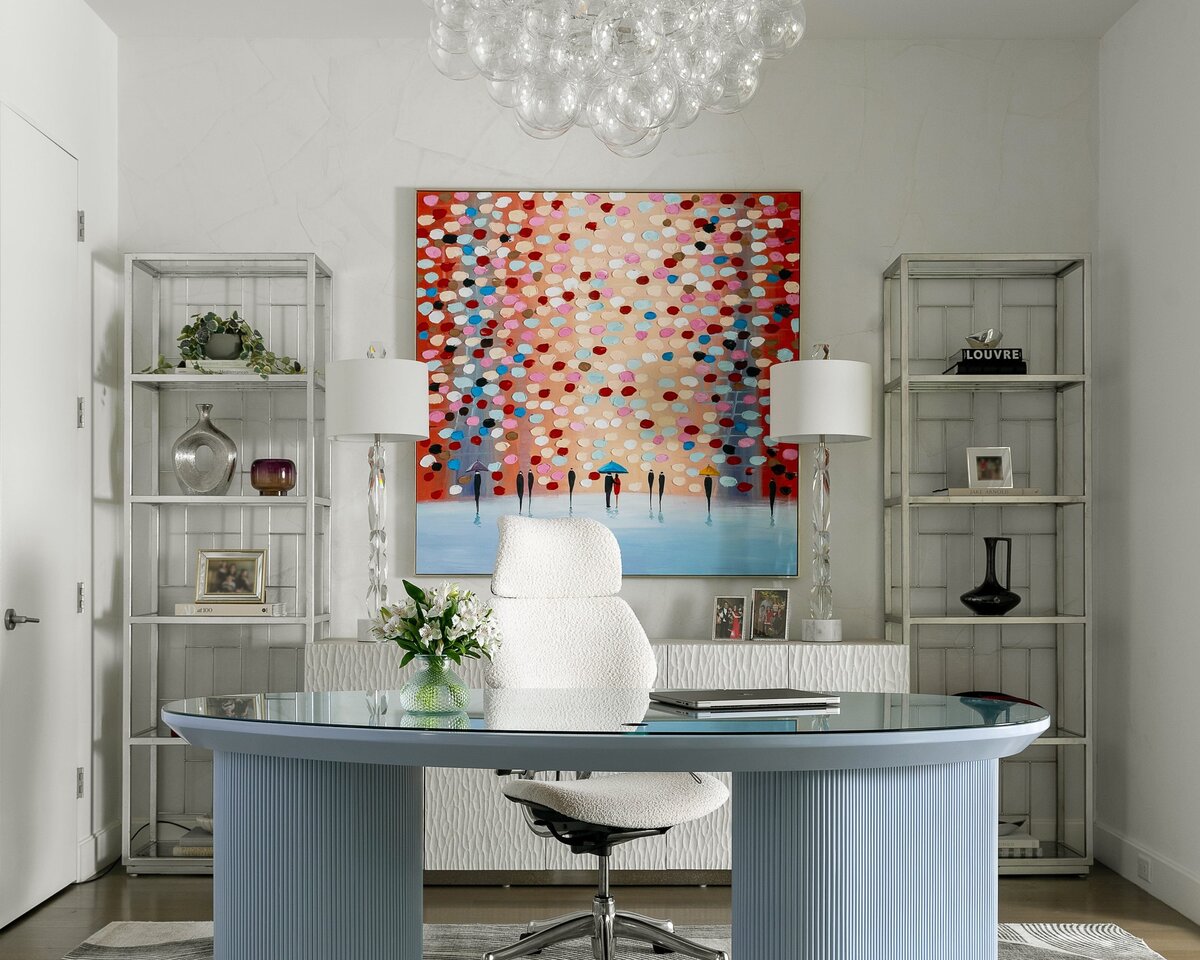 rebekah nicole interiors arbor office with blue desk and painting on wall