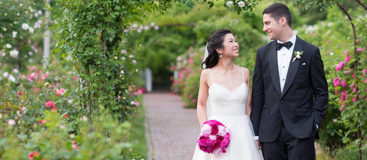 Bride and Groom walking in Rose Garden at Brooklyn Botanical Gardens photo