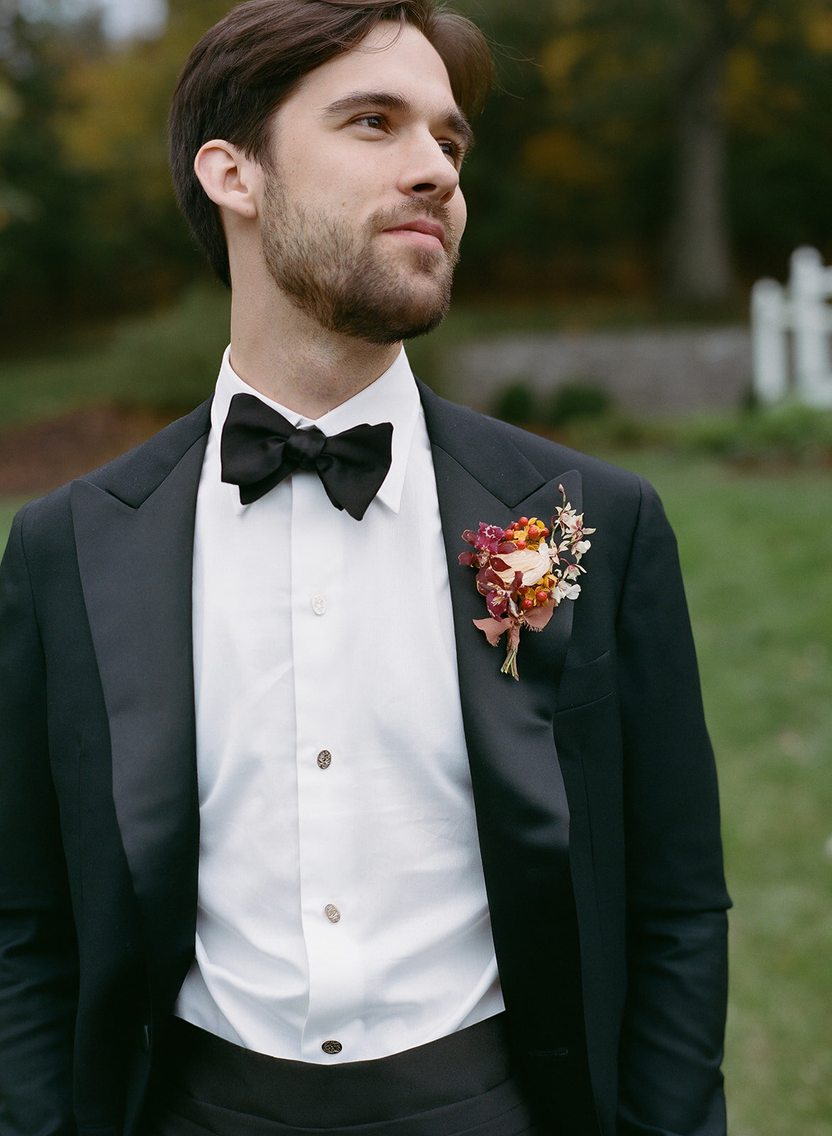 Artistic and textural boutonnieres for autumnal wedding in Tennessee hills. Unique and colorful groomsmen boutonnieres. Boutonnieres in colors of copper, gold, lavender, and ruby featuring orchids, ranunculus, and wildflower textures. Private home wedding ceremony and reception. Design by Rosemary & Finch Floral Design in Nashville, TN.