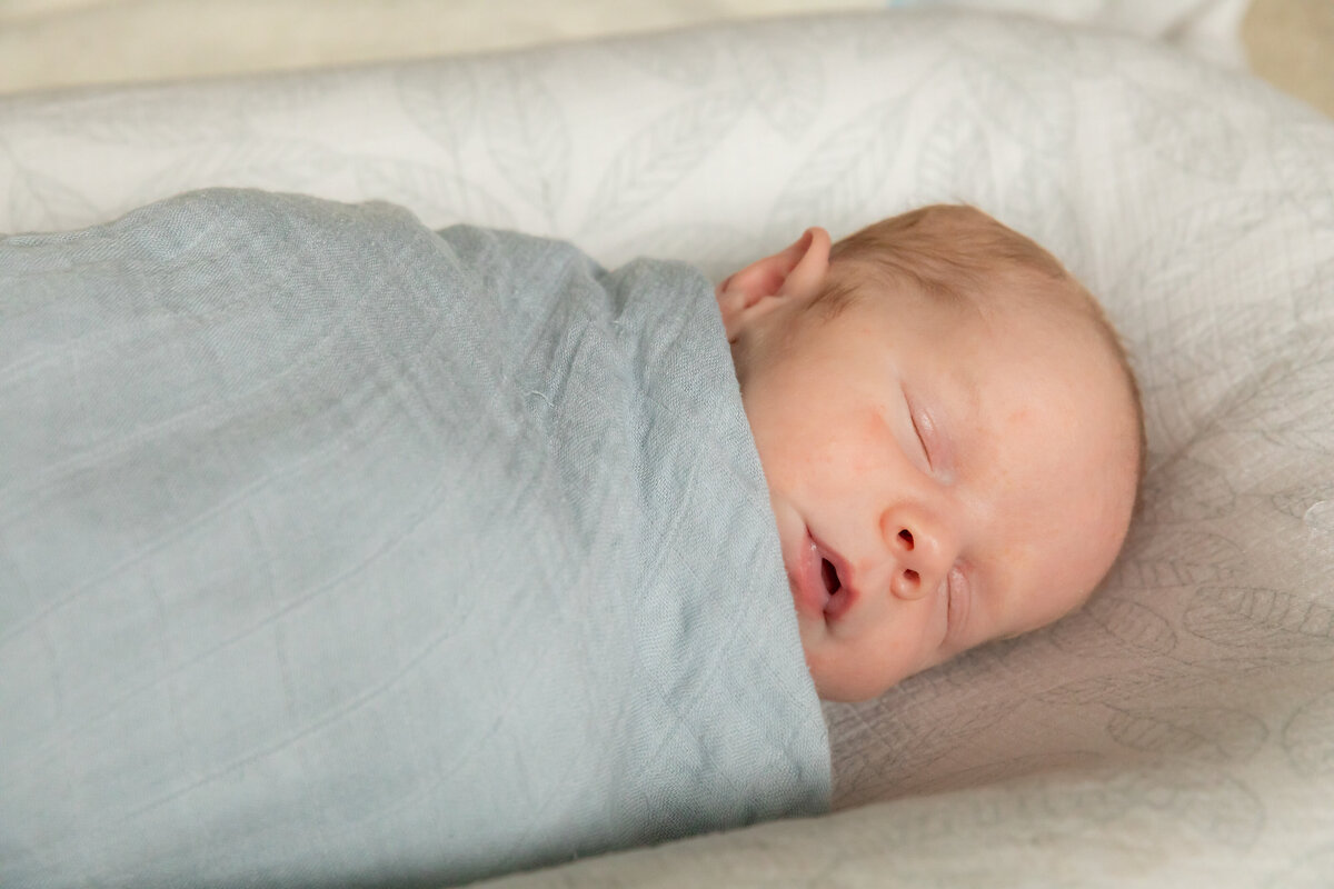 baby-newborn-swaddled-sleeping