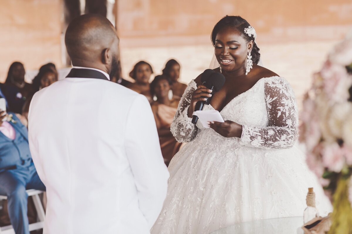 Bride saying vows at wedding ceremony in Cancun