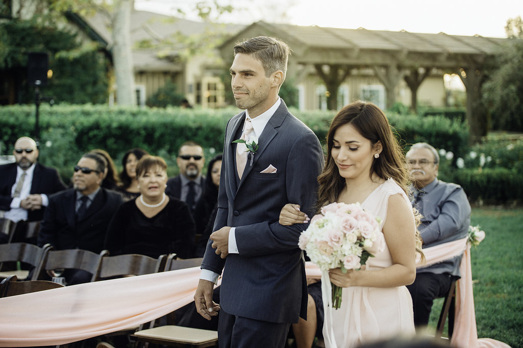 Wedding Photograph Of Groomsman And Bridesmaid Walking Down The Aisle Los Angeles