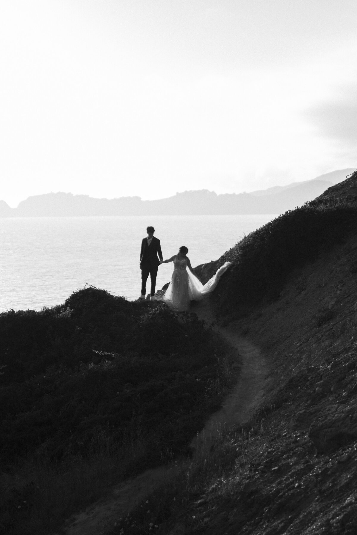 Bride and Groom at Marshall's Beach in San Francisco, California at sunset
