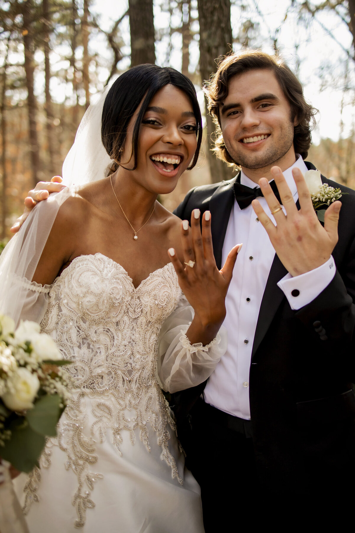 showing off the wedding rings