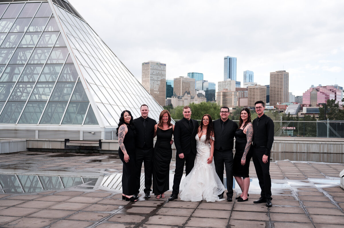 wedding party and bride and groom outside of the Muttart Conservatory