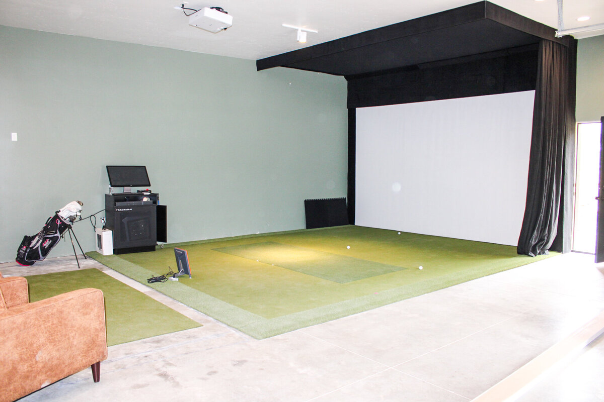 theatre room with white screen  in the process of being built in new home