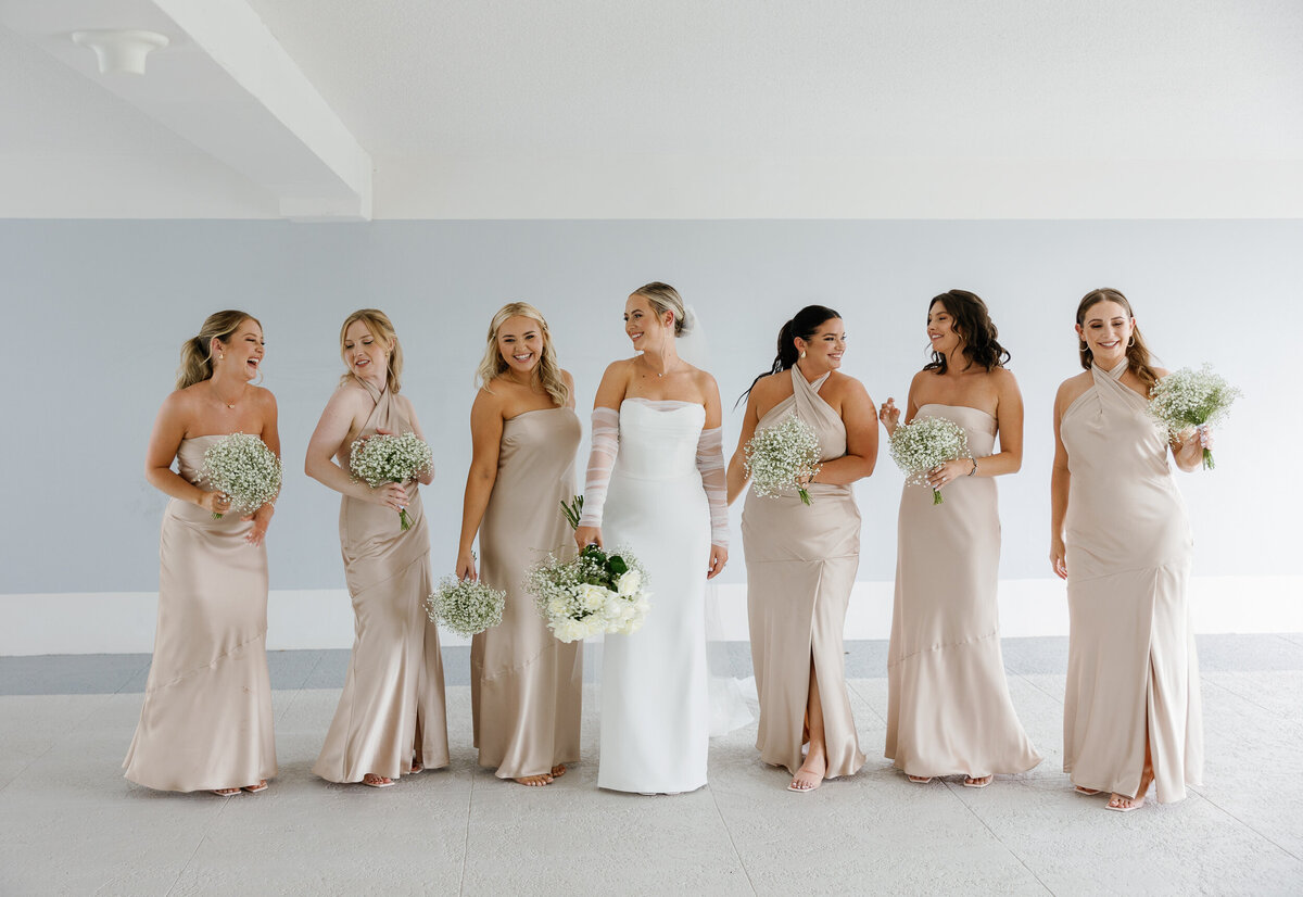 Bride with her bridesmaids in Miami, captured by Claudia Amalia, a wedding and lifestyle photographer based in Miami and Florida Keys South Florida. Specializing in destination weddings.