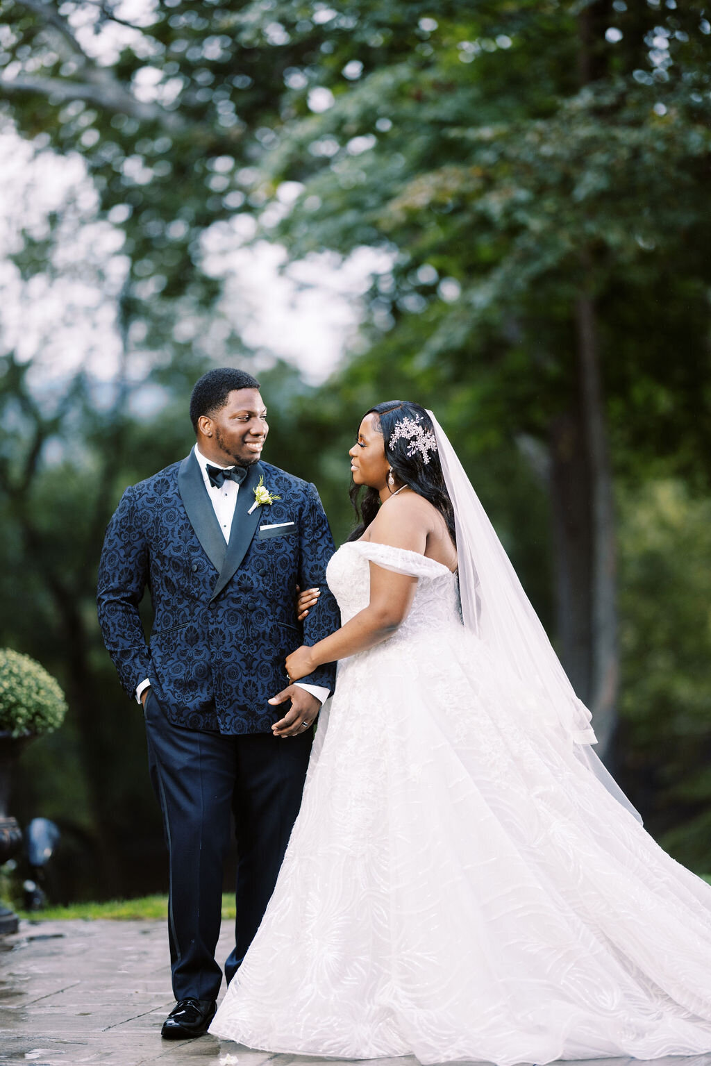 bride and groom smiling at each other