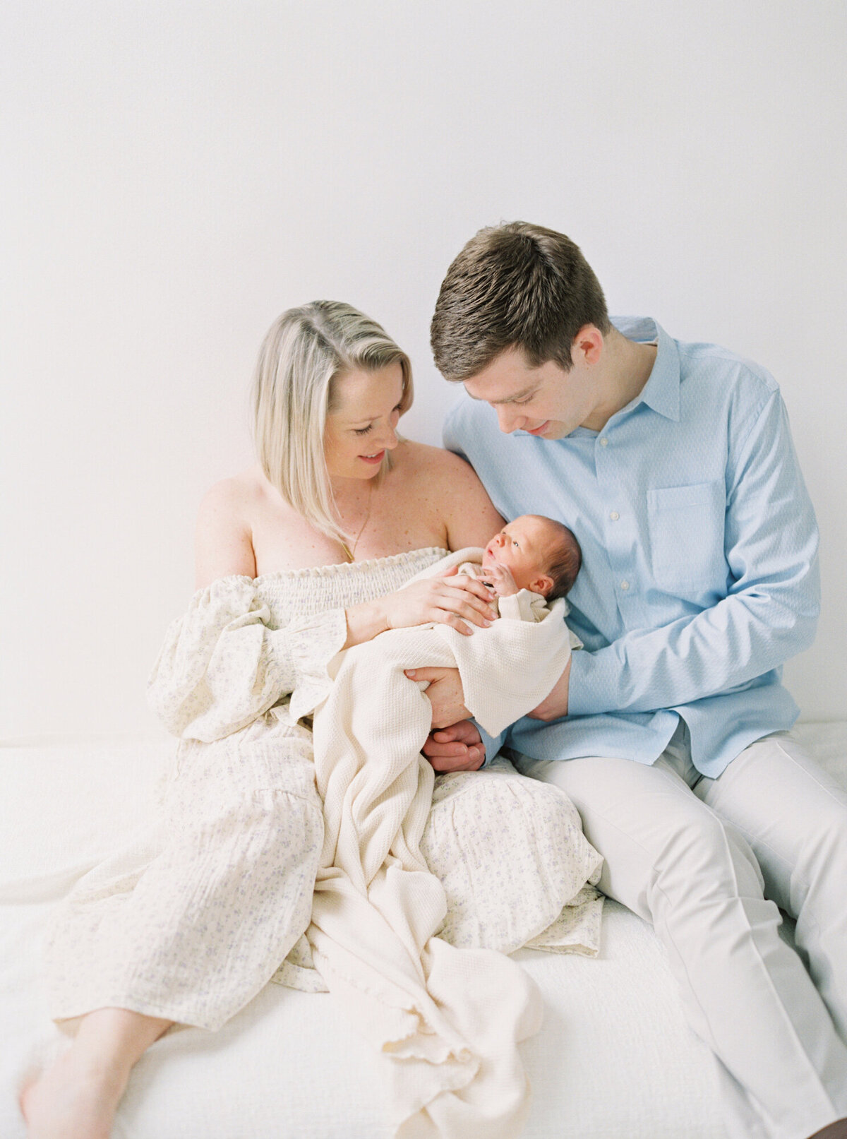 Bright and light filled Seattle Newborn Photos in all white studio on film 
