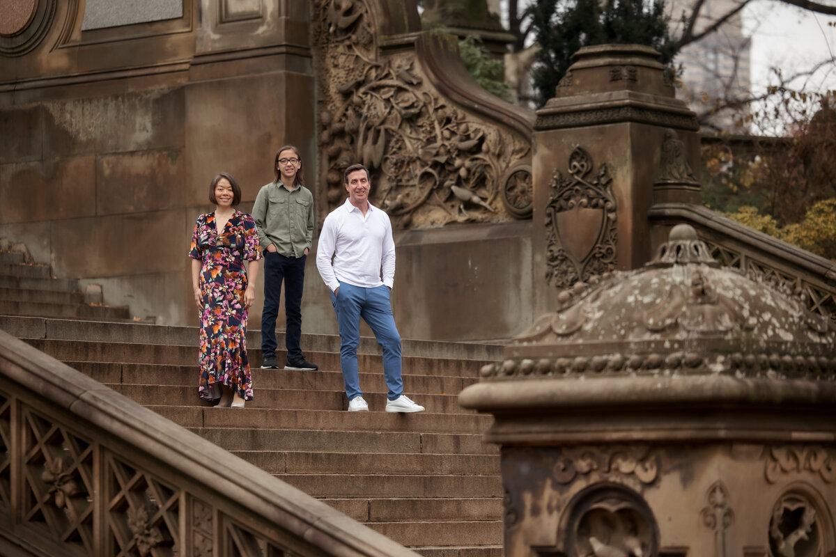 A modern family moment set against the timeless beauty of Central Park's iconic architecture. Effortless style, quiet connection, and a backdrop that speaks to legacy—this portrait captures both where they are now and the story they’re building together.

