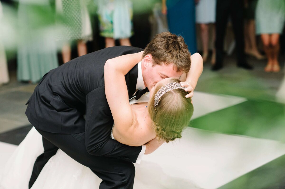 bride and groom kissing on the dance floor