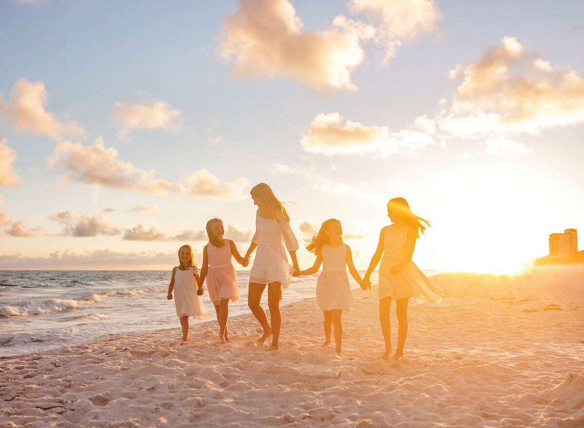 family-walking-at-sunset-navarre-beach-photography