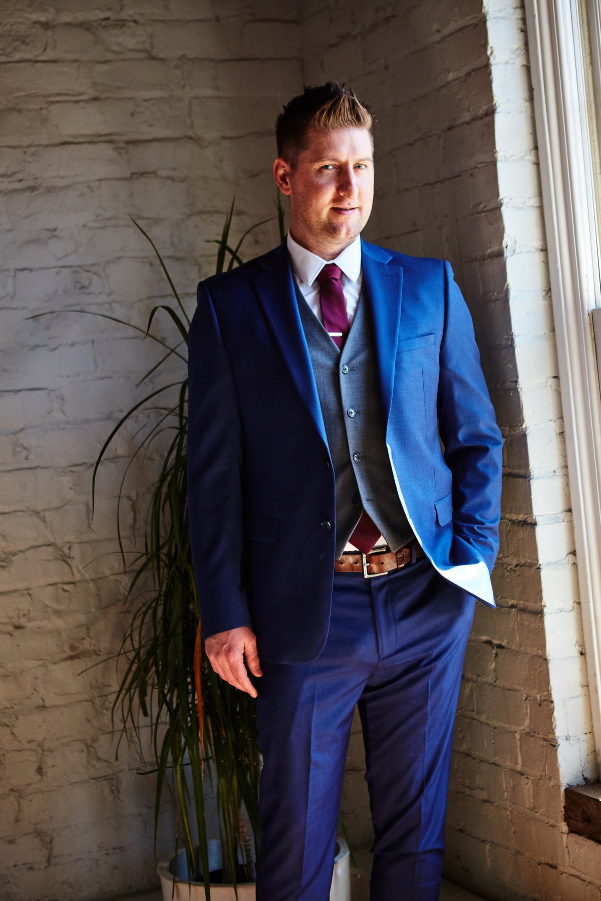 groom-dressed-in-blue-suit