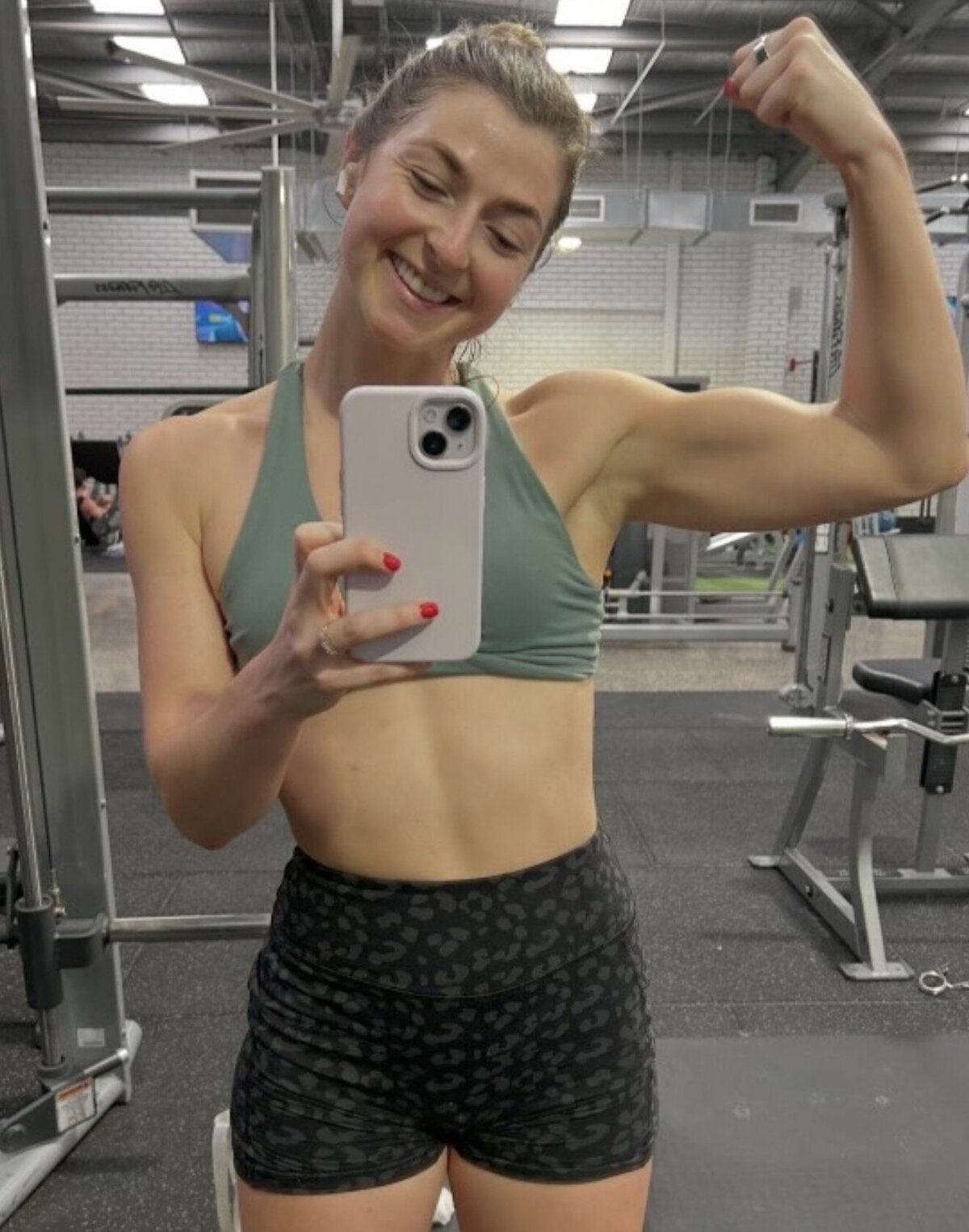 Client flexing in the gym