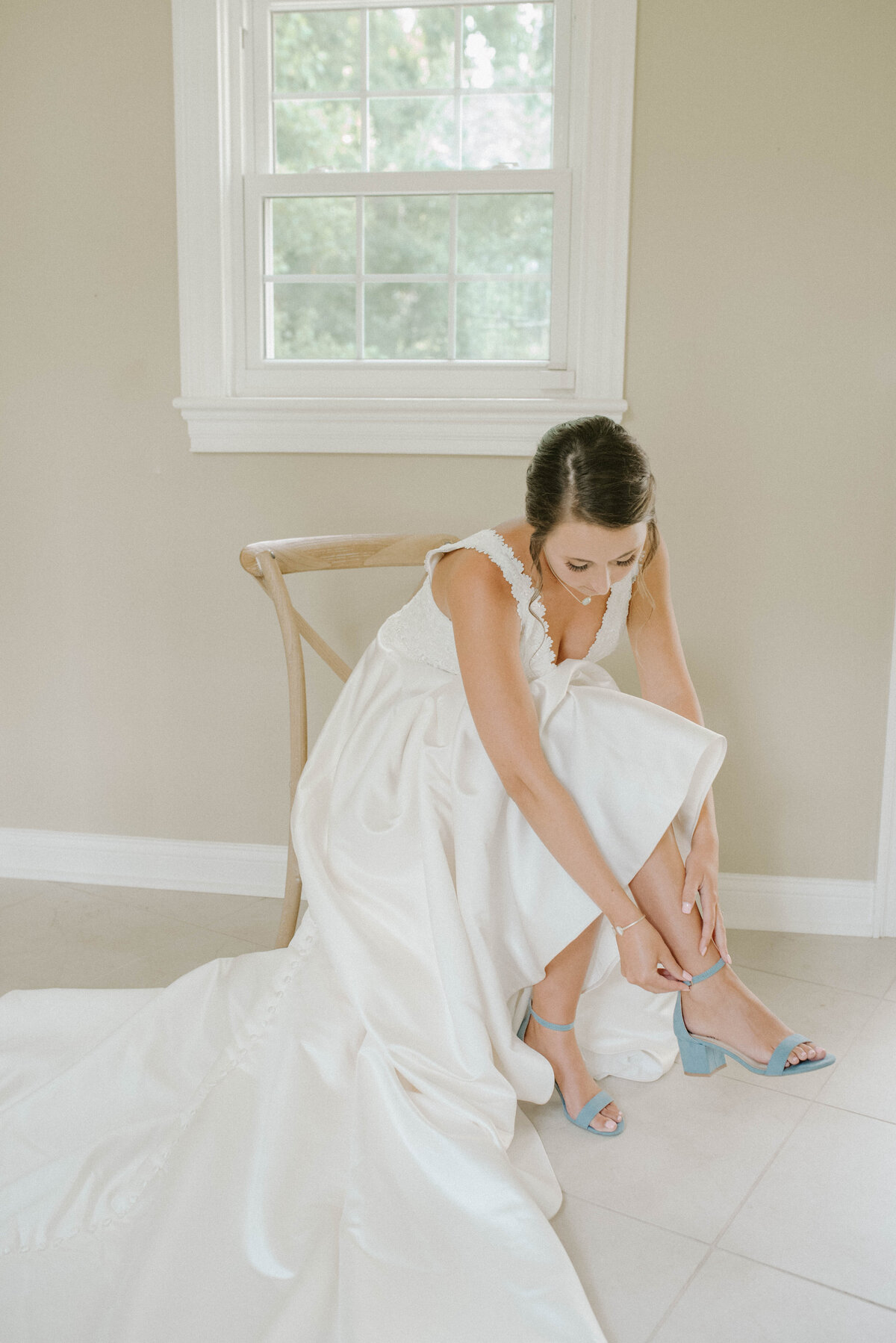 A bride putting on her shoe