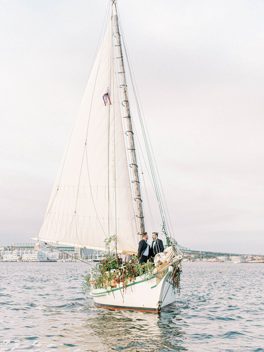 Kate-Murtaugh-Events-Boston-Harbor-sail-boat-yacht-elopement-wedding-planner-moody-florals-skyline-grooms