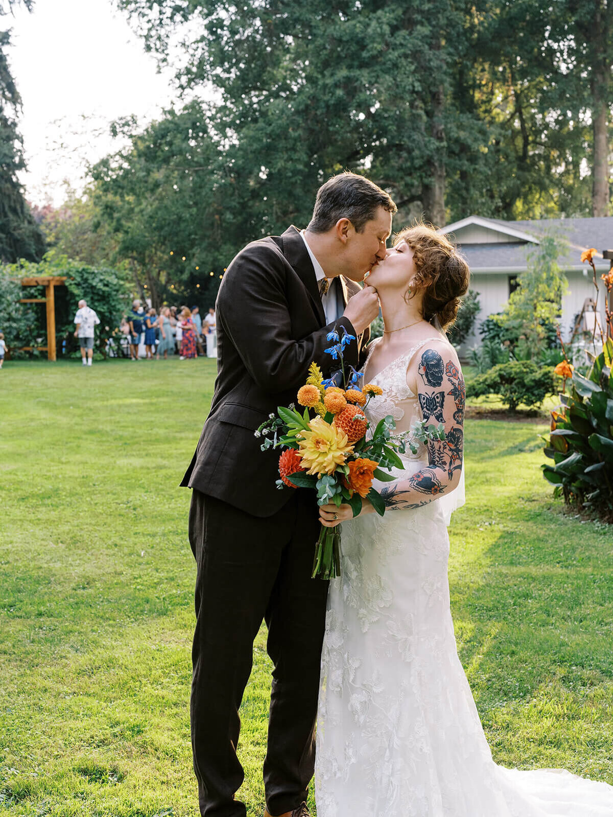 A bride and groom kissing. 
