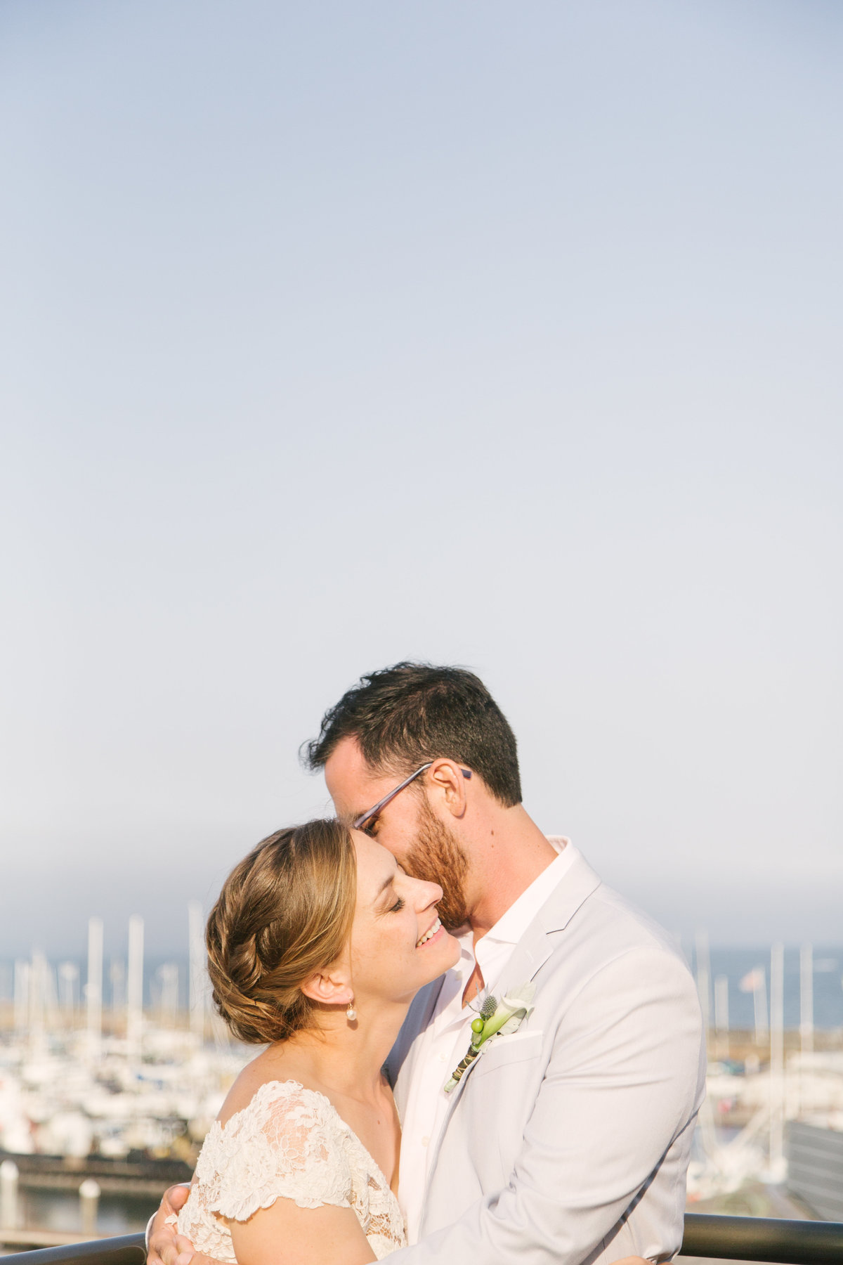 Groom kisses bride at Santa Barbara Maritime Museum wedding