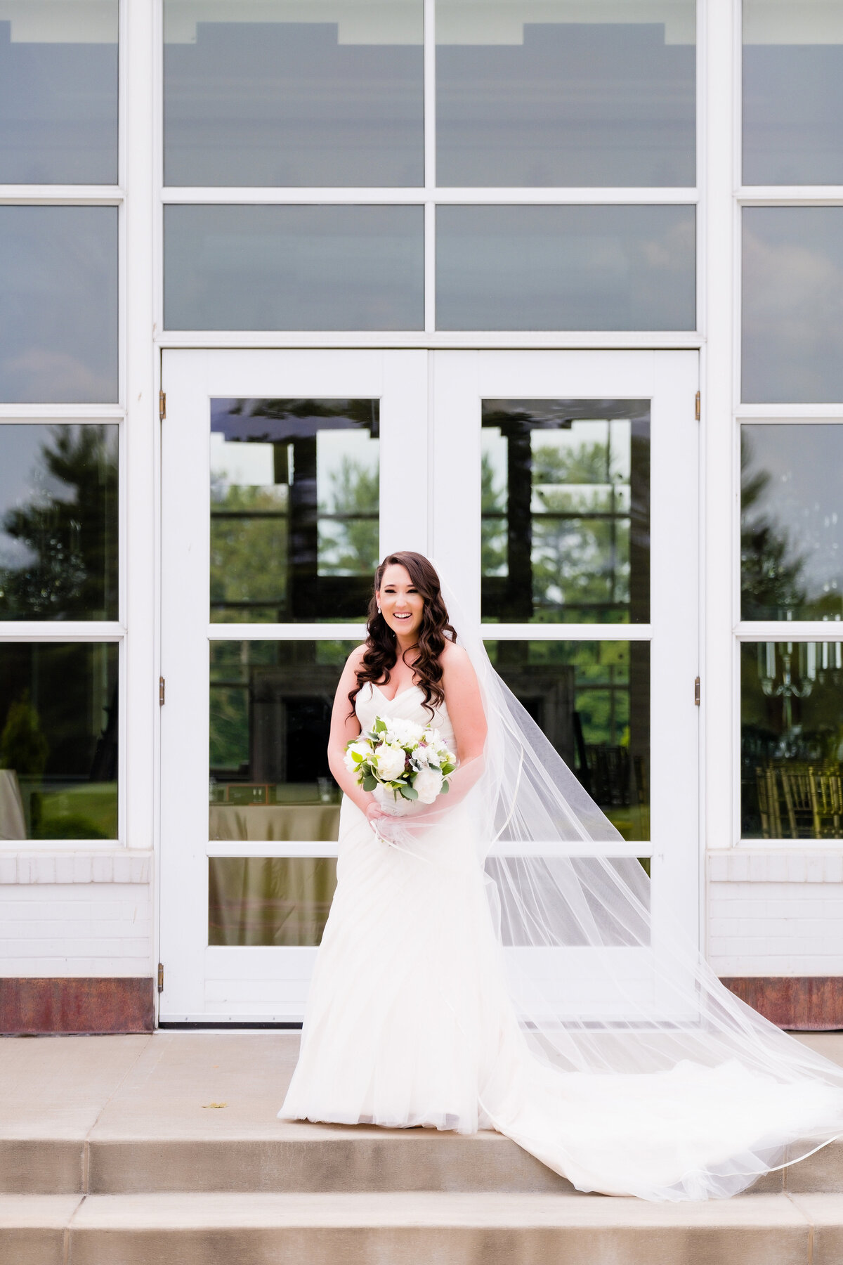 bride posing for photos at Allegheny Country Club in Sewickley