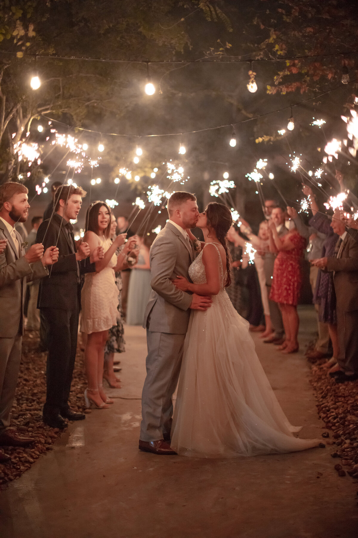 sparkler exit at Geronimo Oaks wedding venue in Seguin by San Antonio wedding photographer Firefly Photography