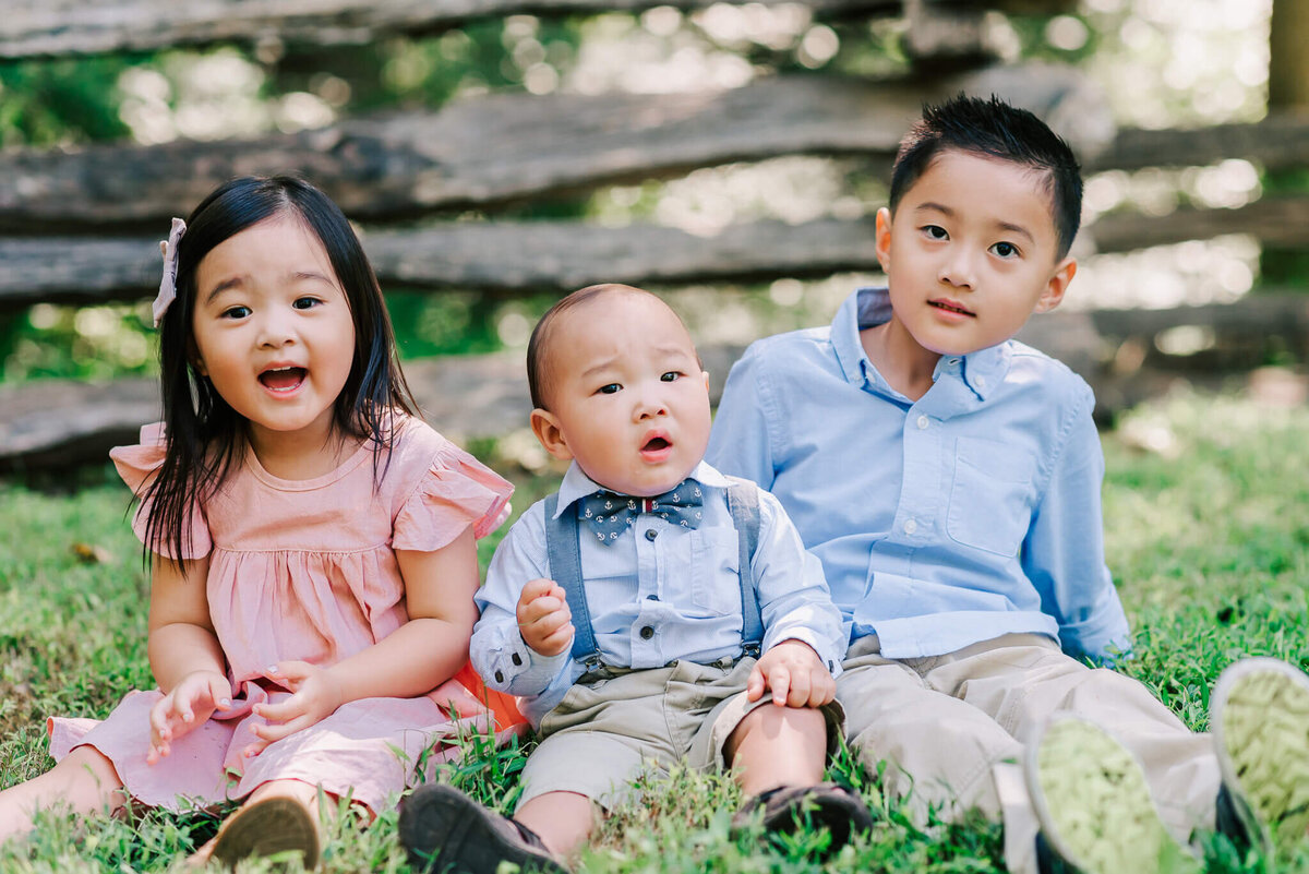 Three korean siblings sitting together, by Denise Van a Northern Virginia Family photographer