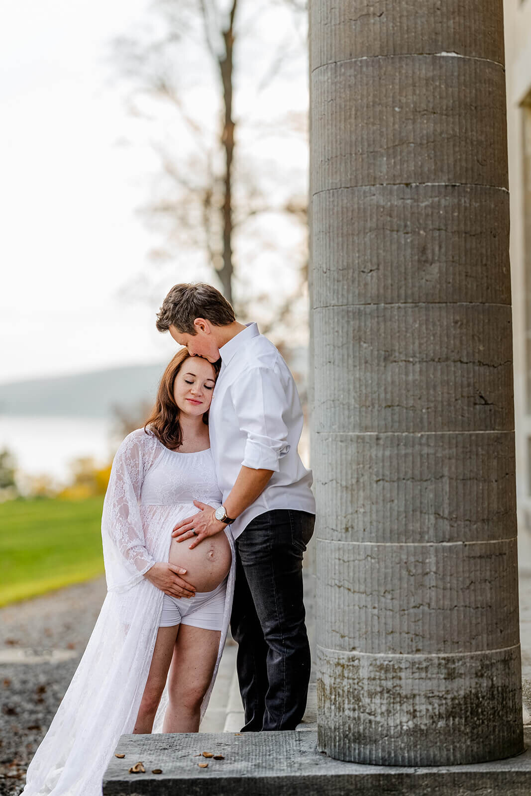 Couple holding baby bump at Finger Lakes maternity session, NY