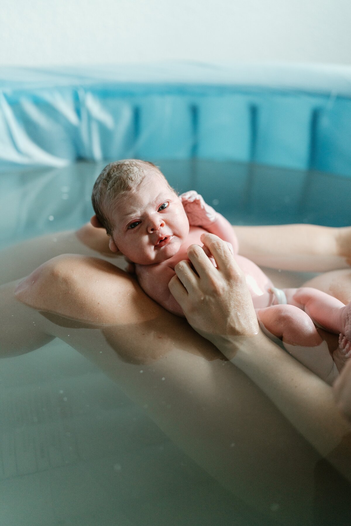 baby girl born in birth tub home birth