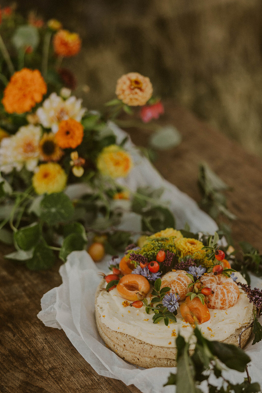 Rustic style cake with mandarins and flowers