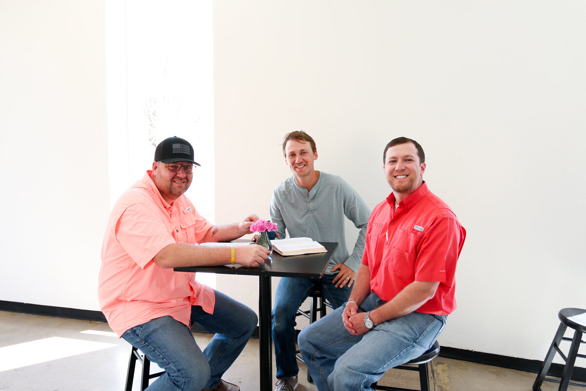 Three men fellowship in hallway- Restoration