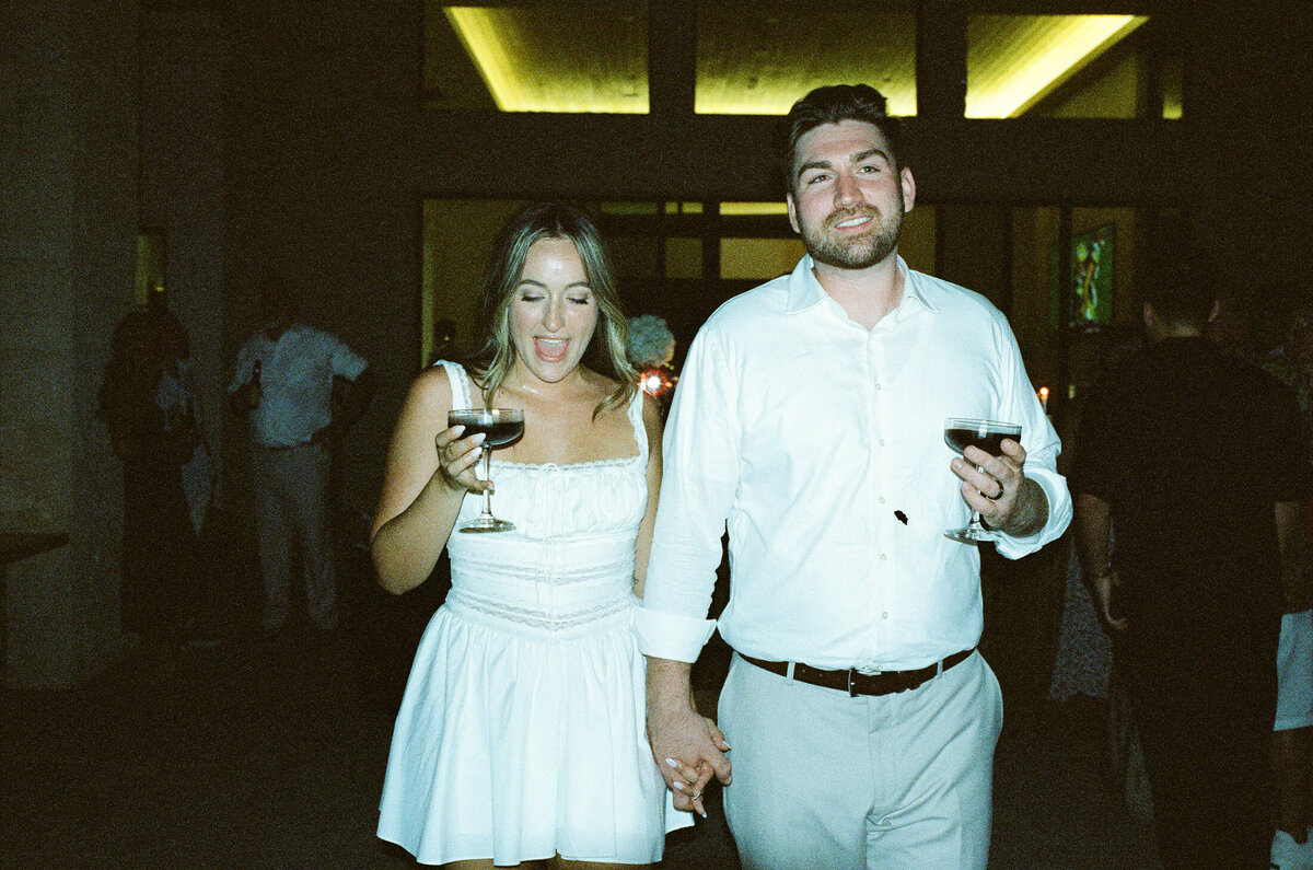 bride and groom holding martini 35mmfilm