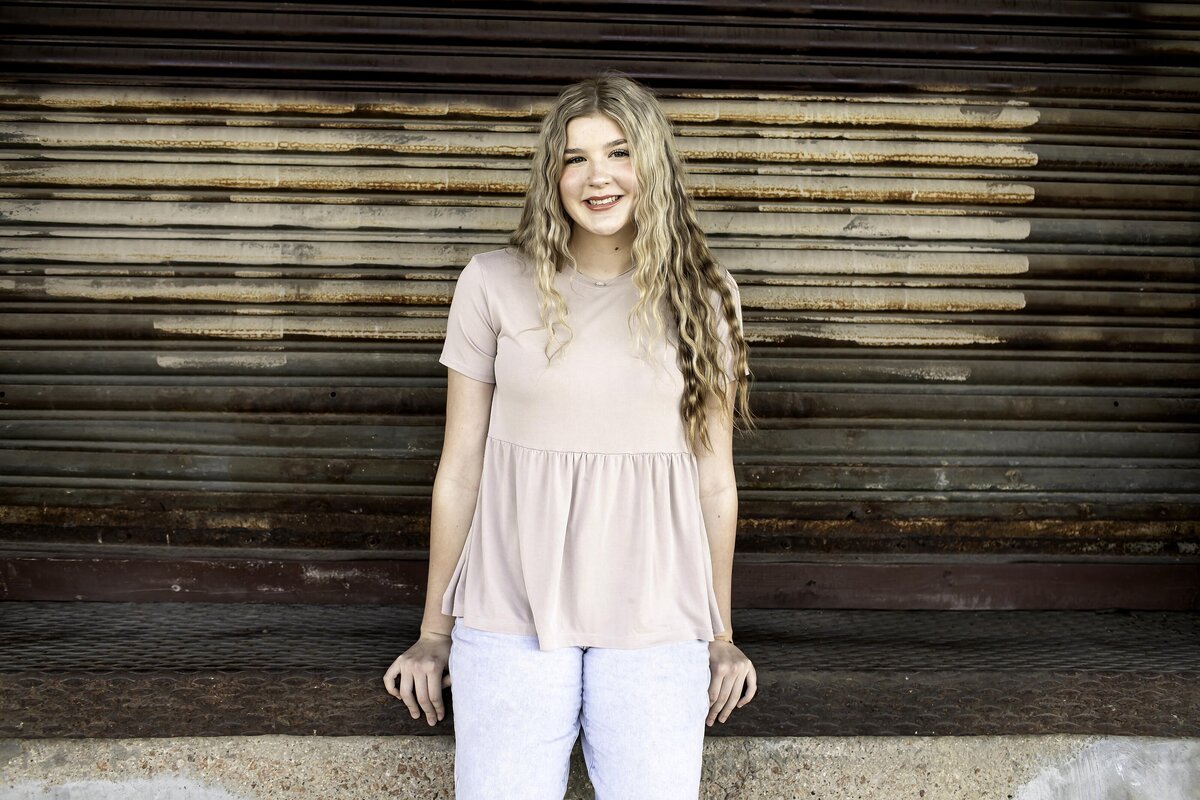 A senior’s bright smile radiates confidence, capturing the excitement of their last year