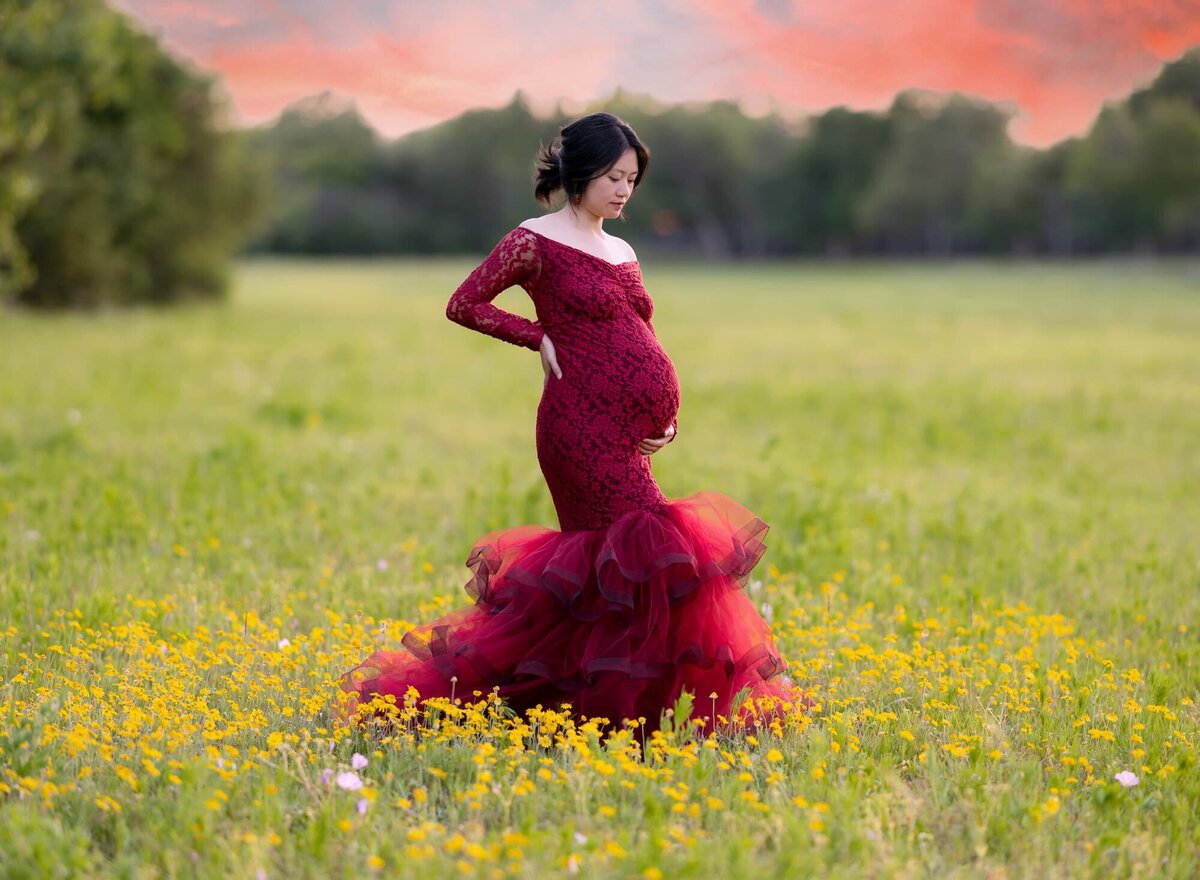 red-gown-maternity-portrait-in-wildflowers-leander