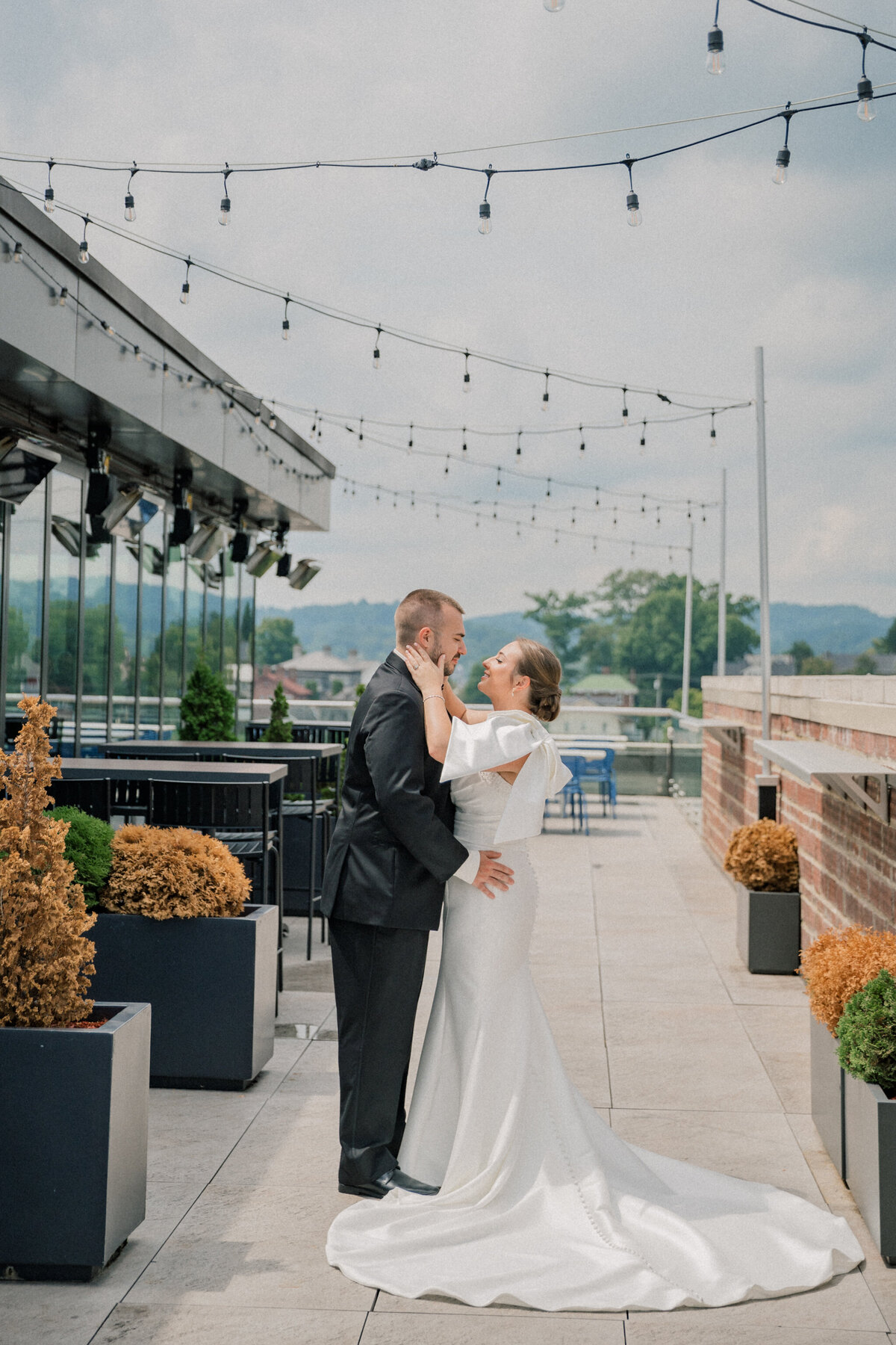 Bride and groom on the rooftop of the Bristol Hotel before their Bristol Train Station wedding