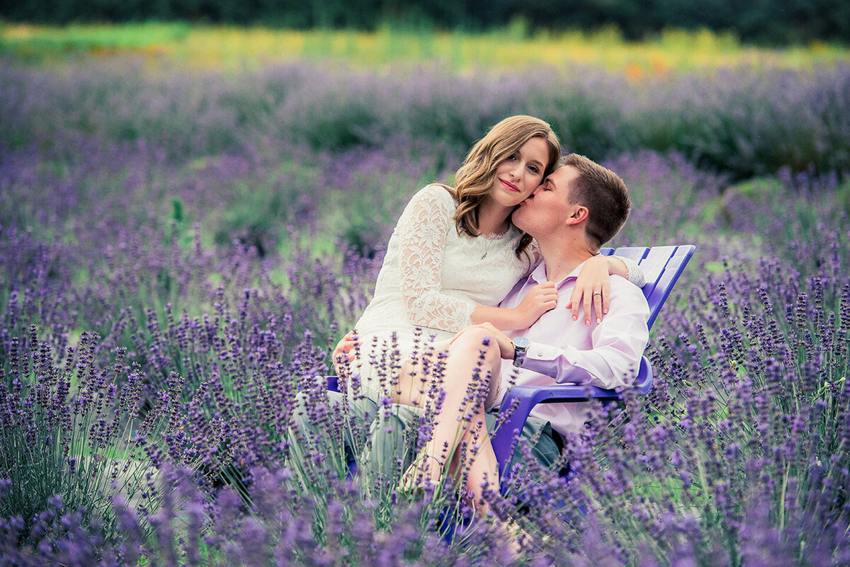 couple sitting on chair in lavender