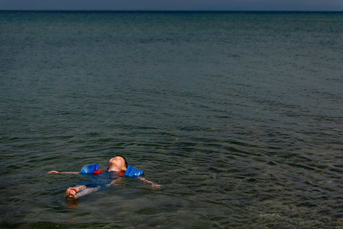 kid-floating-lake-michigan