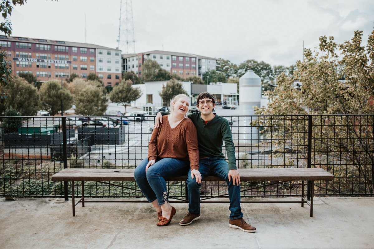 Christine Quarte Photography - Engagement Midtown Westside Provisions Sitting and Laughing