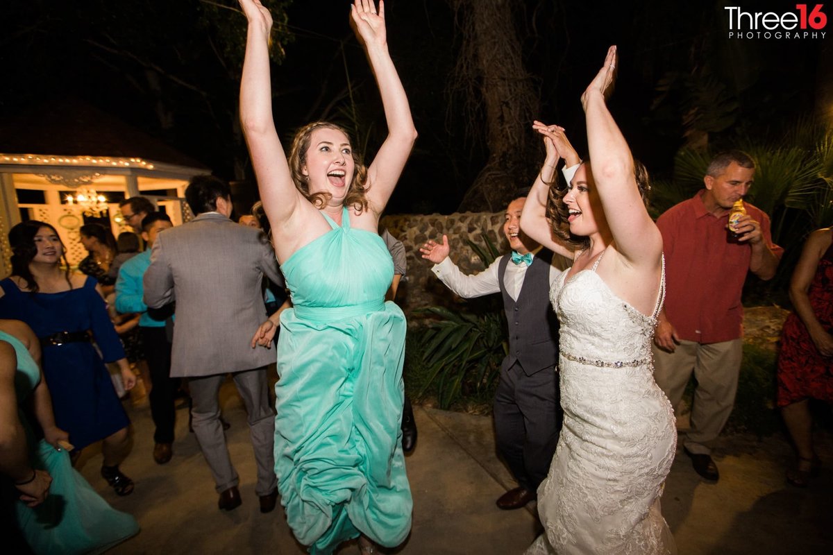 Women dance during a wedding reception