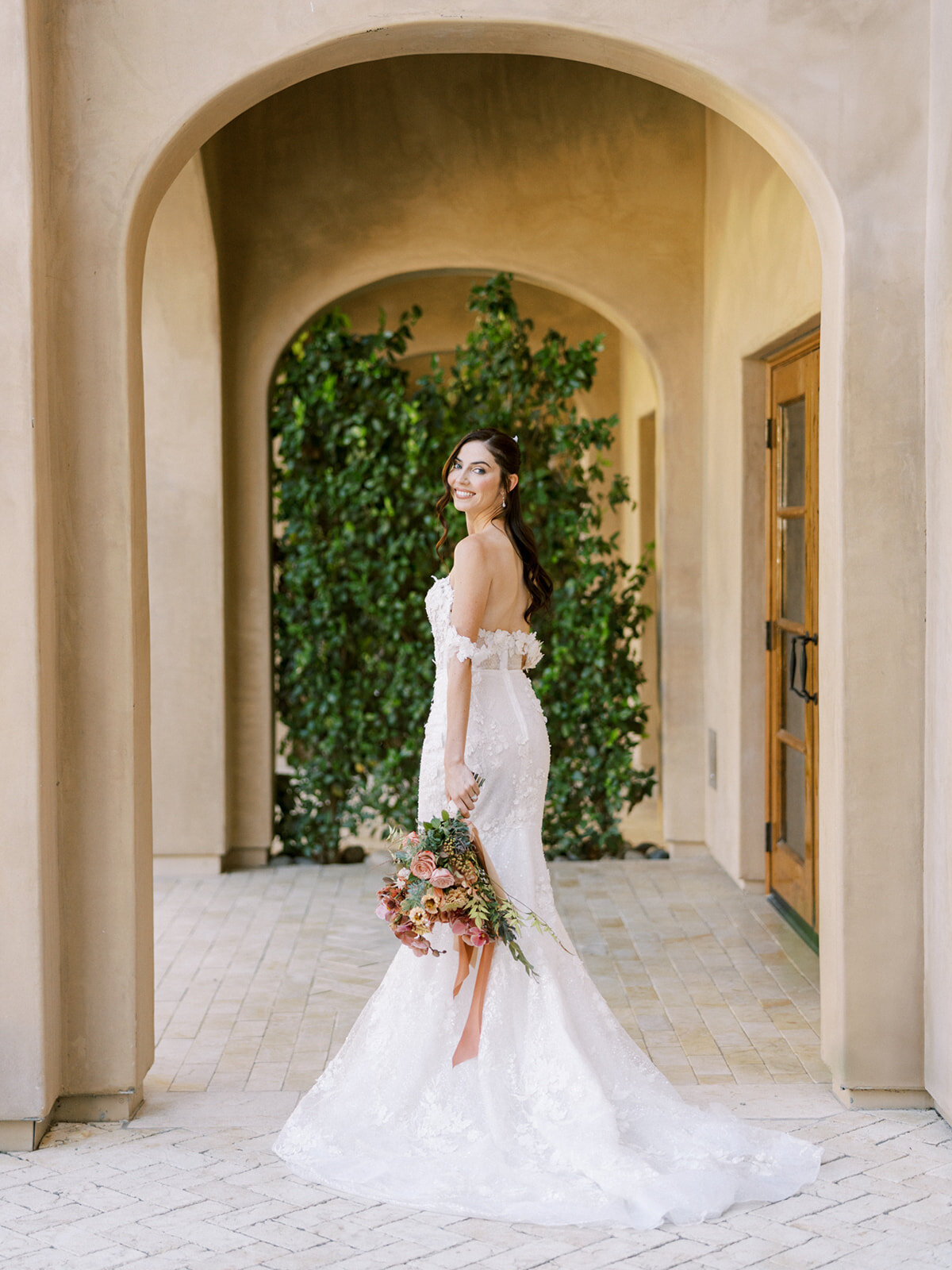 Timeless bridal portrait under the arches at Allegretto Vineyard—elegant, romantic, and effortlessly graceful.