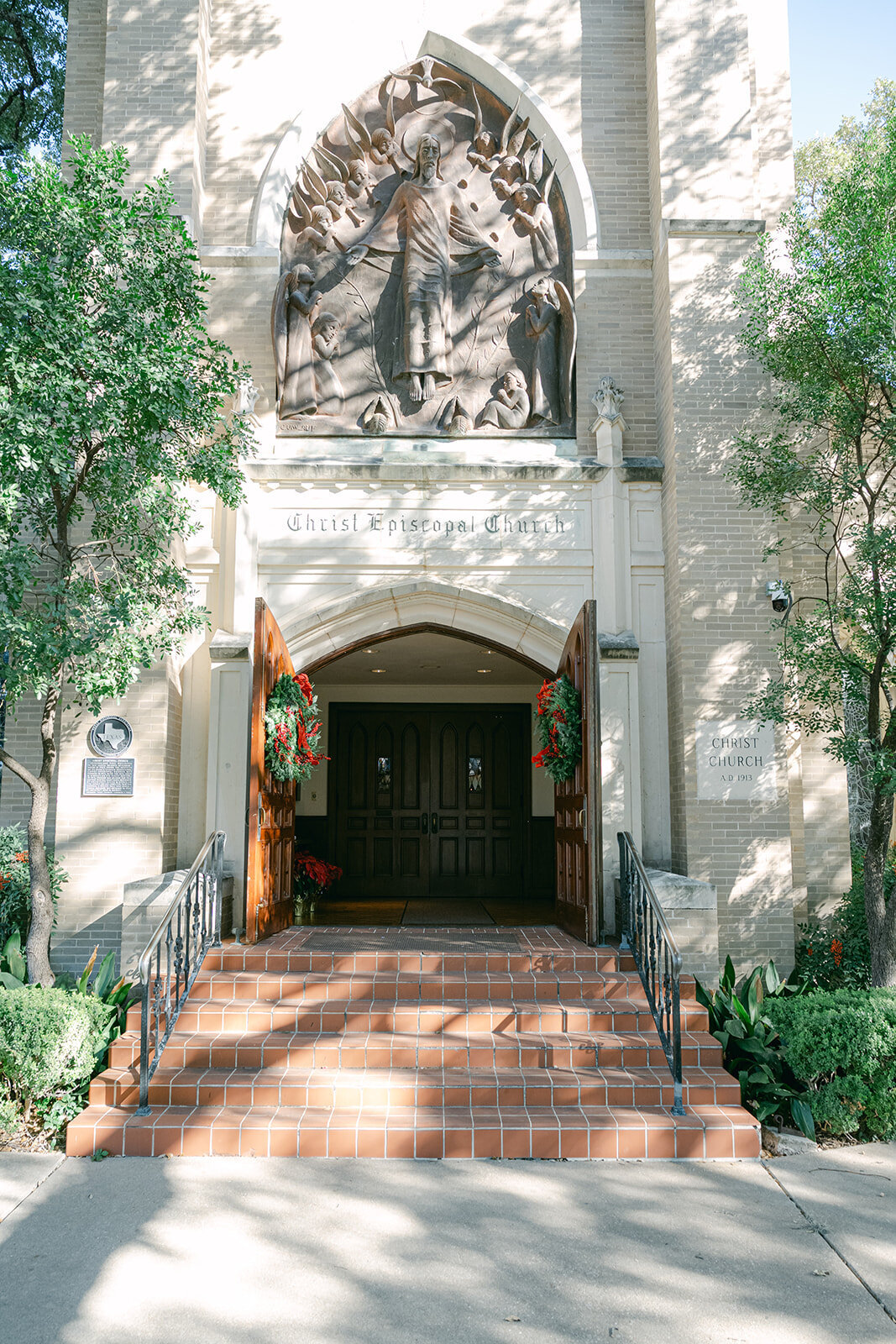 Exterior view of historic church wedding venue in San Antonio surrounded by greenery, ideal for classic ceremonies