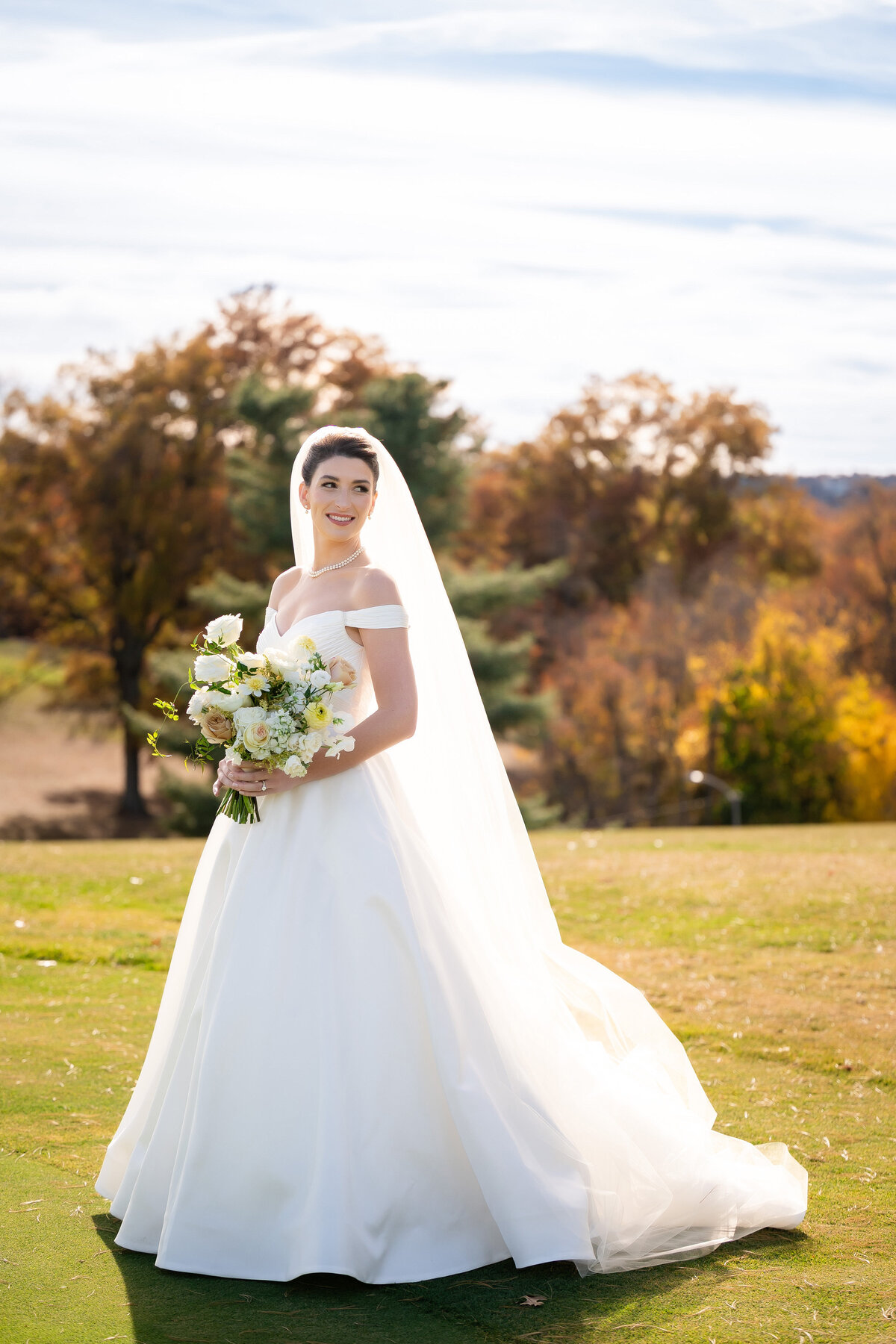 classic pittsburgh bride smiling for wedding photo on the schenley golf course