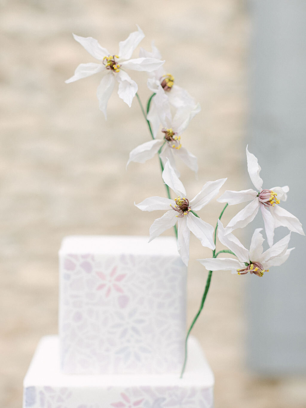 sugar flower on the top of a wedding cake