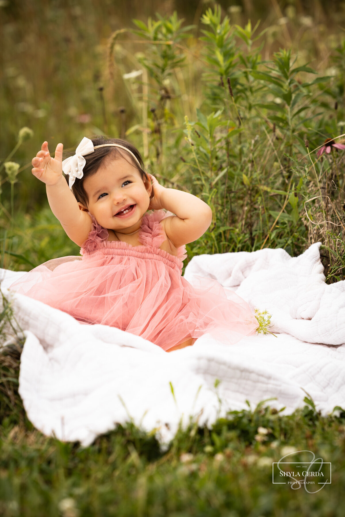 Happy baby laughing during milestone photography Troy Ohio studio