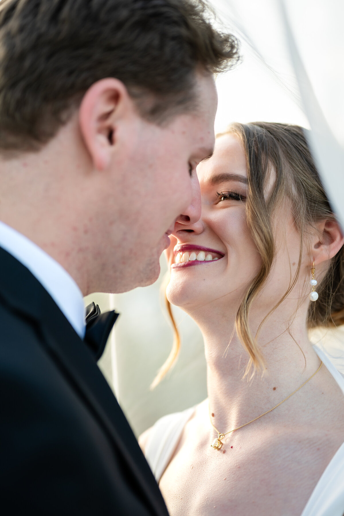 Closeup image of Emma and Adam about to kiss