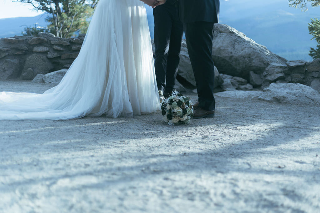 A view of a couple's feet as they say their vows.