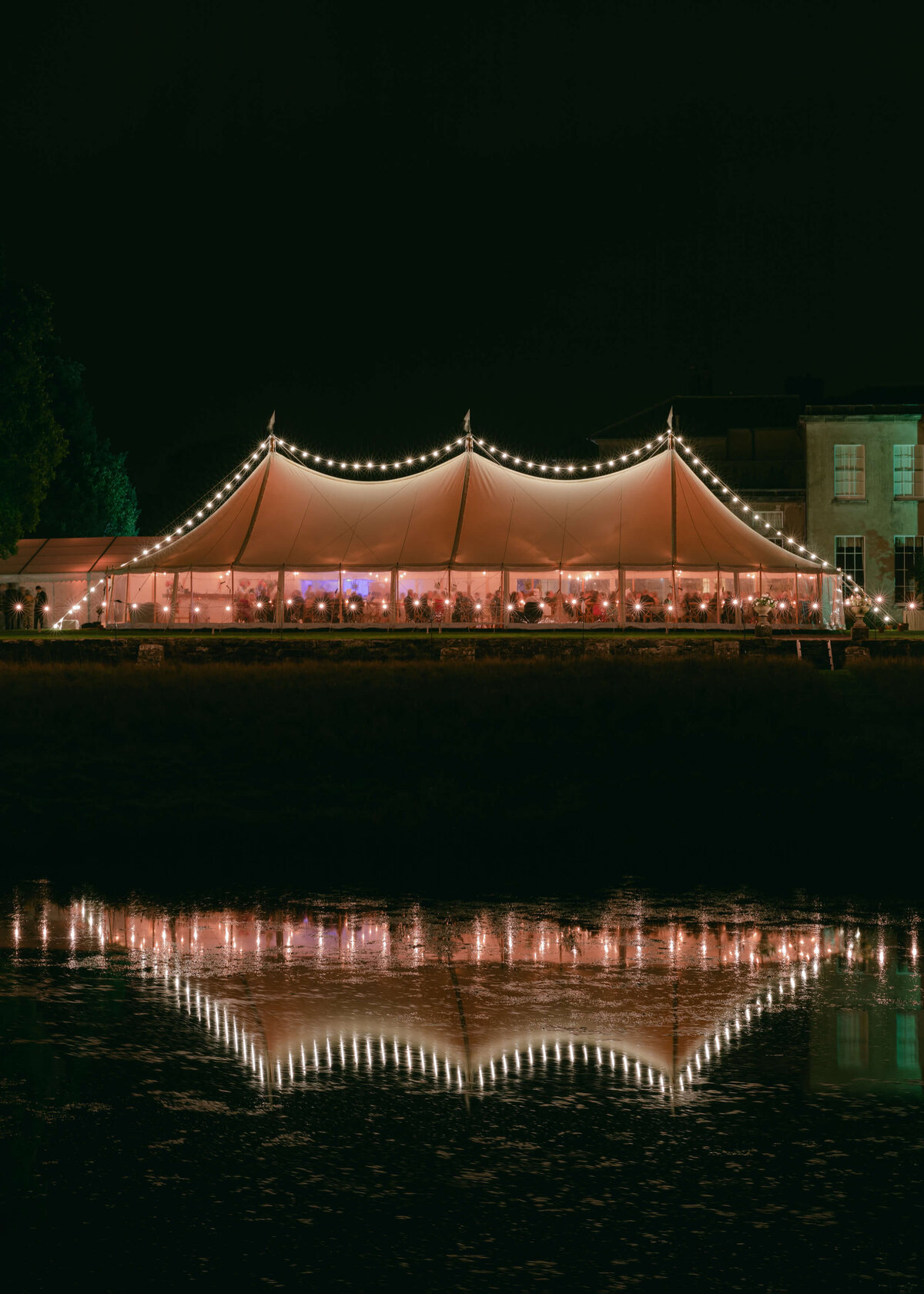 chloe-winstanley-weddings-sailcloth-tent-night-lights-relection