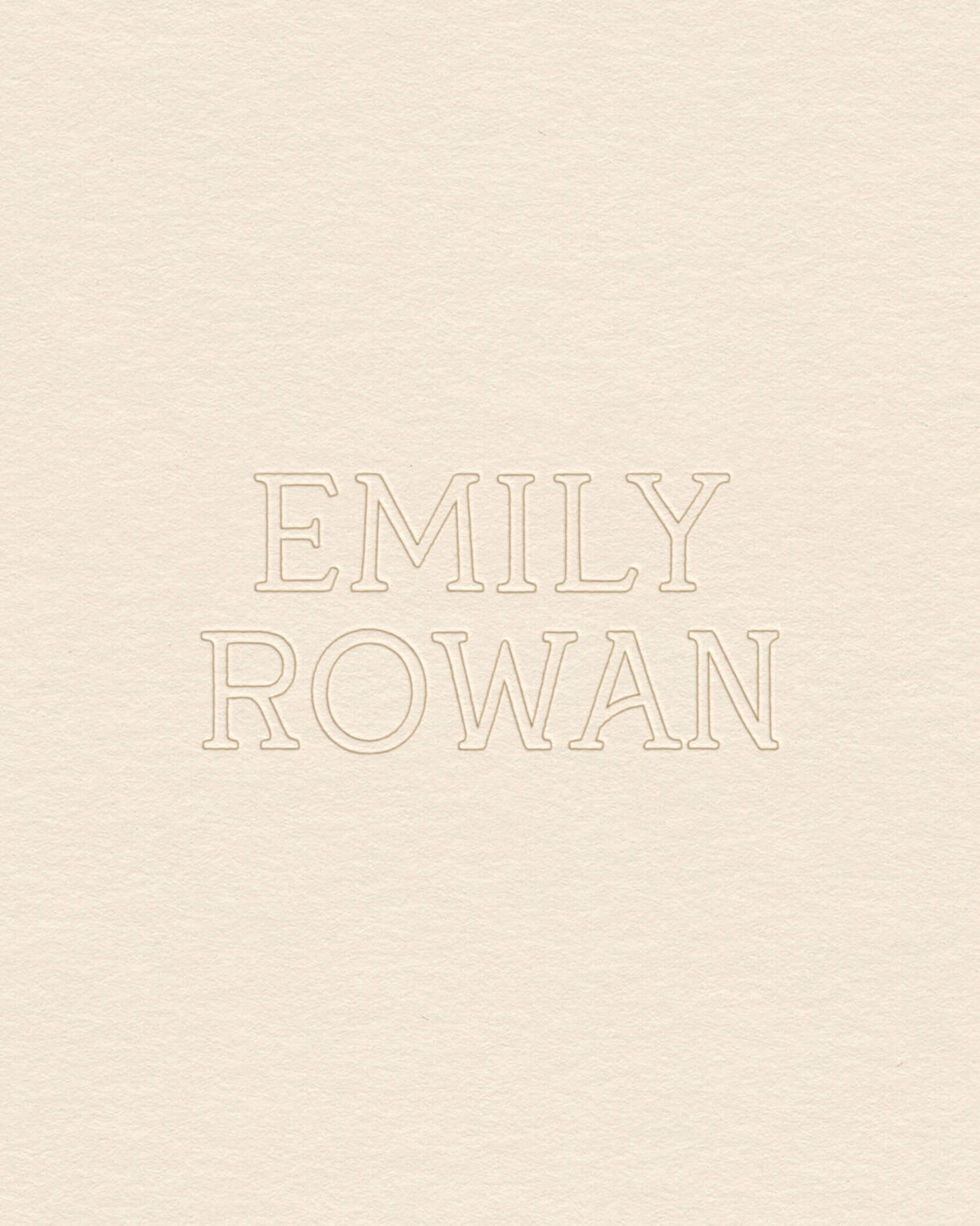Elegant serif wordmark with embossed detail, ideal for refined brand identities seeking soft, timeless visual branding.