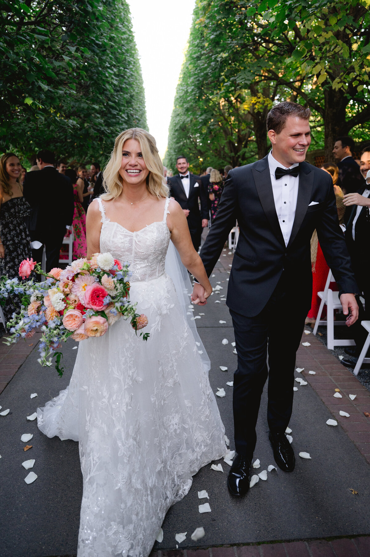 Bride and groom walking down the aisle post-ceremony at the Chicago Botanic Gardens.