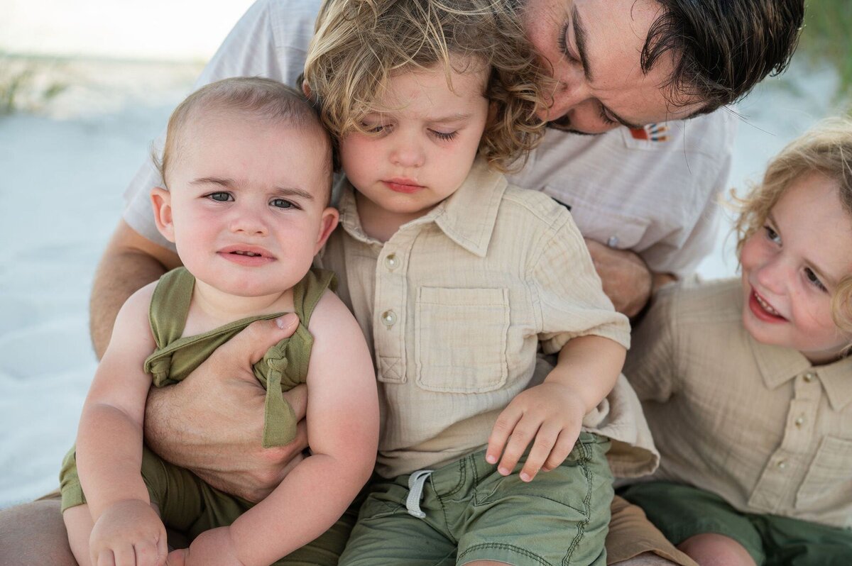 dad with boy in dunes at Pensacola Beach