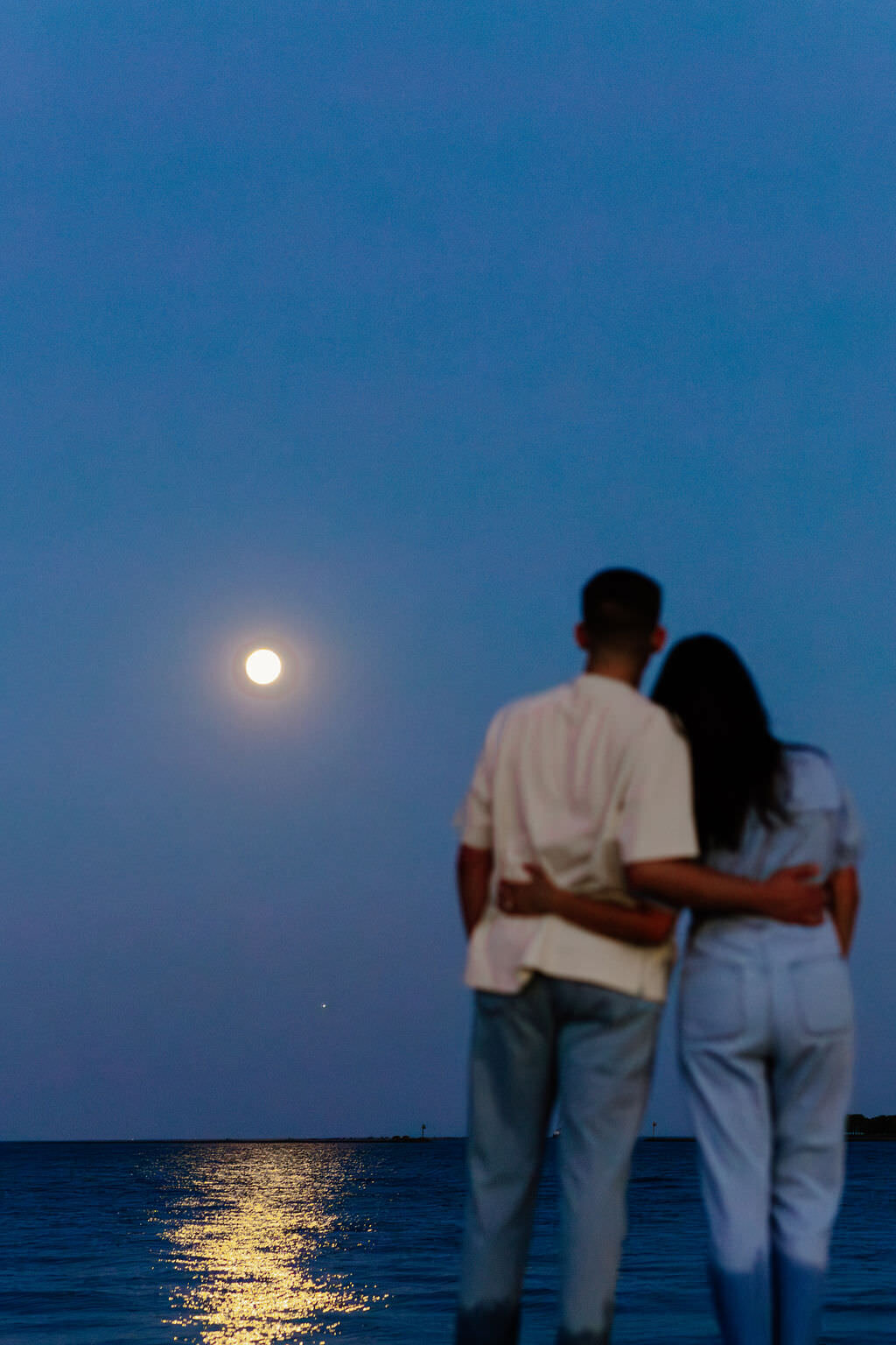 An engagement photography session at The Wrigley Building and North Ave Beach in Chicago, Illinois - 43